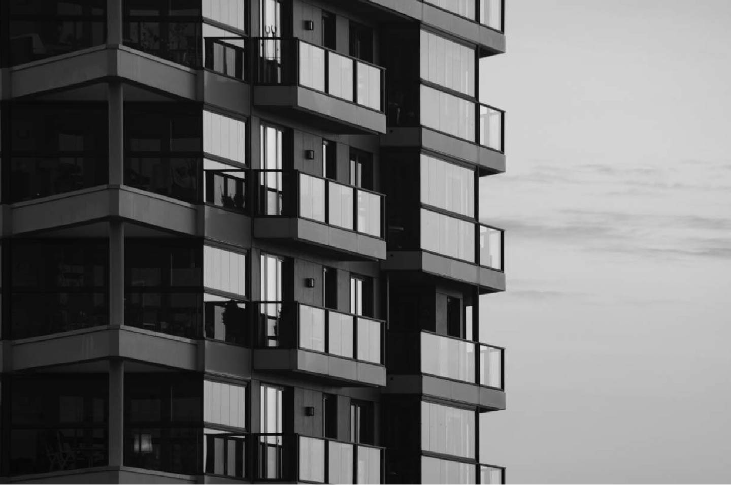 Black and white closeup image of a section of a building.